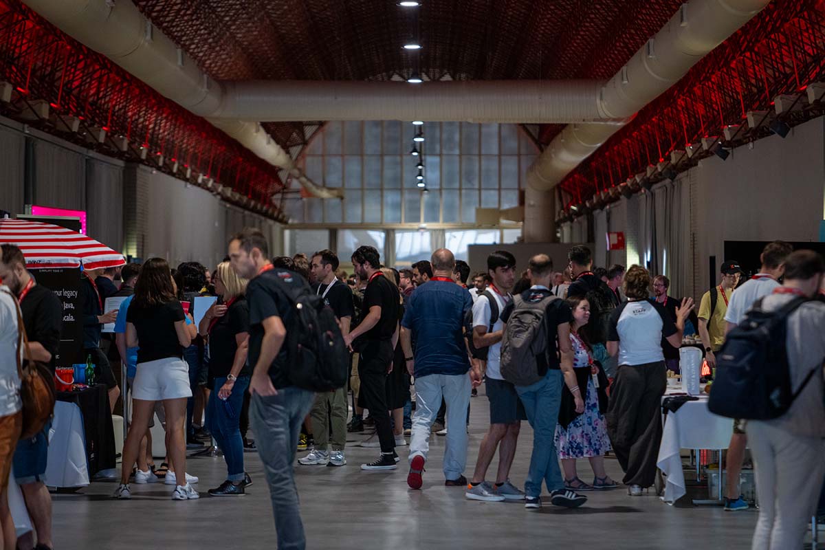 Attendees meeting with vendors at Scala Days Madrid