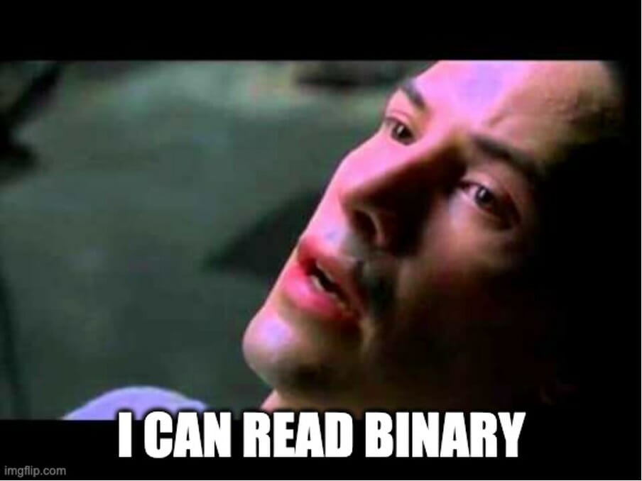 Matrix meme: Neo in a chair saying "I can read binary."